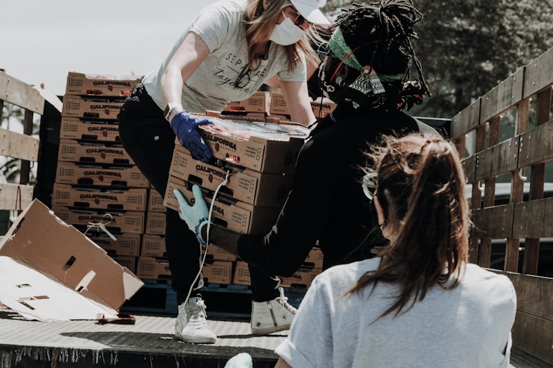 Staff packing goods into cartons for shipment